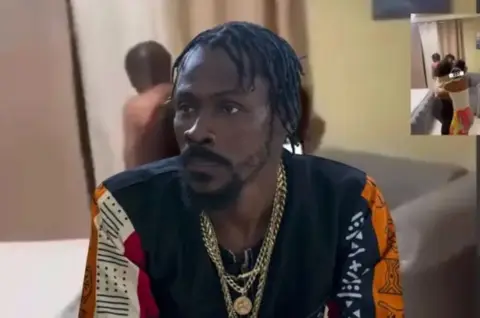 Jefe de banda haitiana Vitel’Homme es sorprendido por su esposa en pleno romance con amante: estalla pelea brutal